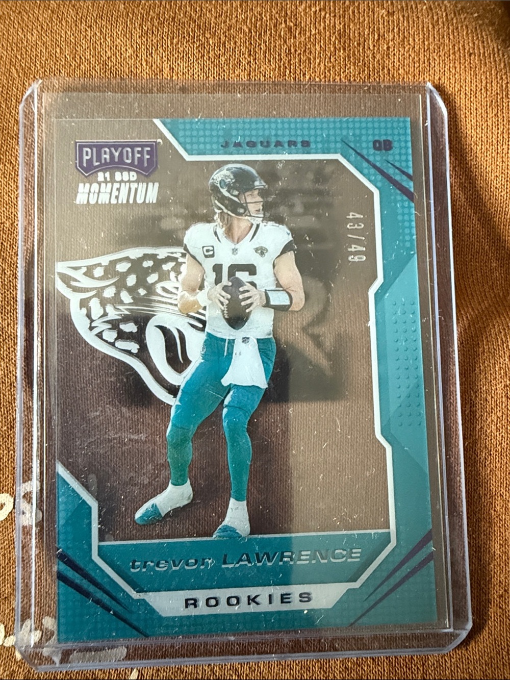 Trevor Lawrence Playoff Momentum Rookies Football Card - Teal/White #43/49